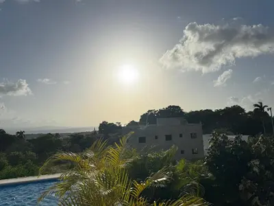 a view of a building with the sun in the sky at Casa Vista Mar in Río San Juan
