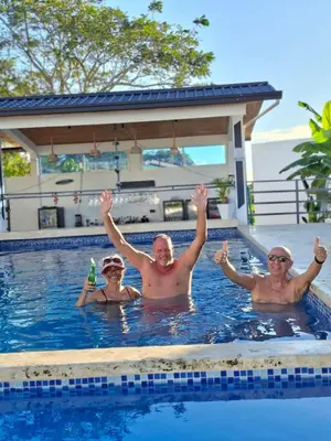 a group of people in a swimming pool at aparthotel las taranas in Villa Riva