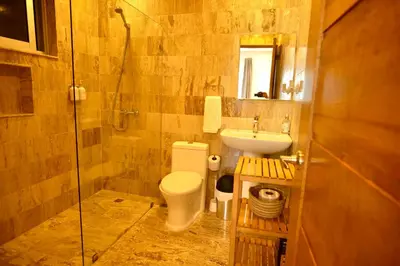 a bathroom with a toilet and a sink and a shower at JardinesDelMontSerrat-LasTerrenas-NearBeach Cozy 2BR-3BDS-6PAX-WiFi in Las Terrenas