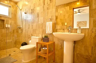 a bathroom with a sink and a toilet and a shower at JardinesDelMontSerrat-LasTerrenas-NearBeach Cozy 2BR-3BDS-6PAX-WiFi in Las Terrenas