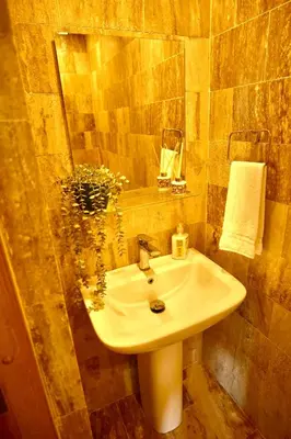 a bathroom with a white sink and a mirror at JardinesDelMontSerrat-LasTerrenas-NearBeach Cozy 2BR-3BDS-6PAX-WiFi in Las Terrenas