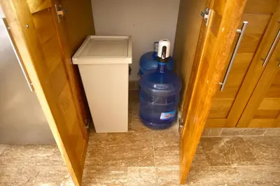 a room with a large water bottle and a trash can at JardinesDelMontSerrat-LasTerrenas-NearBeach Cozy 2BR-3BDS-6PAX-WiFi in Las Terrenas