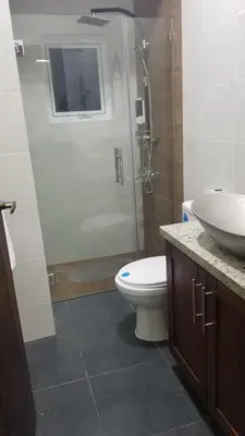 a bathroom with a shower and a toilet and a sink at My Deligth in San Felipe de Puerto Plata