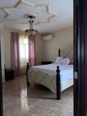 a bedroom with a large bed with a star ceiling at casa en Puerto Plata para 2 in San Felipe de Puerto Plata