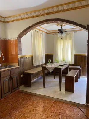 a dining room with a table and a ceiling at casa en Puerto Plata para 2 in San Felipe de Puerto Plata