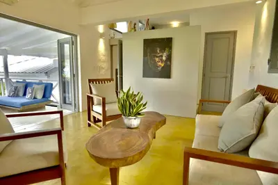 a living room with a couch and a table at Villa Valentine LomaBonitaLasTerrenas in Las Terrenas