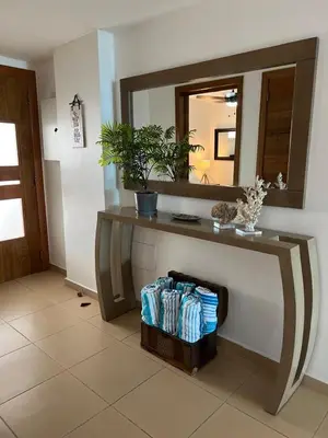 a bathroom with a vanity with a mirror and towels at Marbella-SeaView-FrontBeach-Cozy-2Br-2Bds-4Pax-WiFi in Villas del Mar