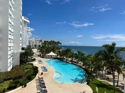 an aerial view of a resort with a swimming pool at Marbella-SeaView-FrontBeach-Cozy-2Br-2Bds-4Pax-WiFi in Villas del Mar