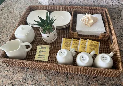 a wicker basket with dishes and teapots on a table at Marbella-SeaView-FrontBeach-Cozy-2Br-2Bds-4Pax-WiFi in Villas del Mar