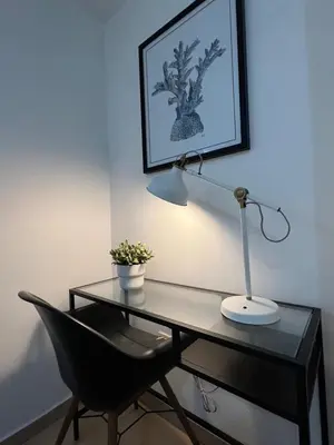 a desk with a lamp and a chair in a room at Marbella-SeaView-FrontBeach-Cozy-2Br-2Bds-4Pax-WiFi in Villas del Mar