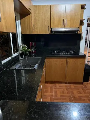 a kitchen with a sink and a counter top at Villa Jarabacoa in Concepción de La Vega