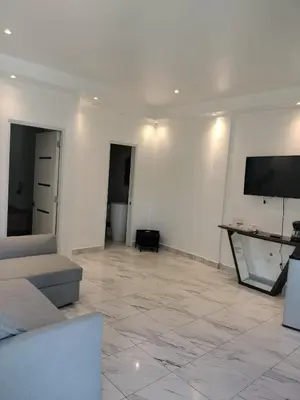 a living room with a couch and a flat screen tv at Vacacional las pascualas in Sánchez