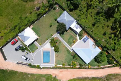 an overhead view of a large house with a pool at Casa Palma El Limon Samana in El Limón