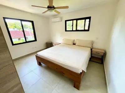 a bedroom with a bed and a ceiling fan at Villa Valentina Cabarete Procab in Cabarete