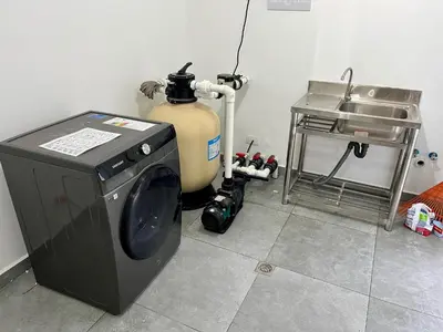 a washing machine sitting in a kitchen next to a sink at Villa Valentina Cabarete Procab in Cabarete