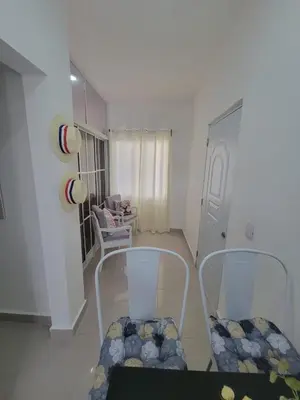 a living room with two chairs and a table at The Omelís House in Santa Bárbara de Samaná