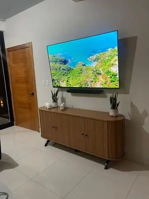 a flat screen tv on a wall in a living room at modern y acogedor in San Felipe de Puerto Plata