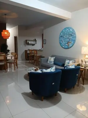 a living room with two blue couches and a table at modern y acogedor in San Felipe de Puerto Plata