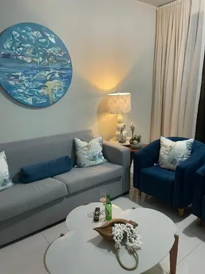 a living room with a couch and two chairs and a table at modern y acogedor in San Felipe de Puerto Plata