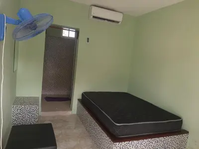 a small room with a bed and a fan at Tarde trankila in Sabana de Nisibón