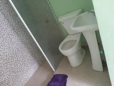 a bathroom with a toilet and a sink at Tarde trankila in Sabana de Nisibón