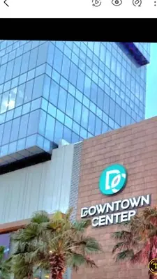 a brown convention center building with a sign on it at Lindo 1BD apt in Bella Vista with Pool, Rooftop,Gym,Parking in Santo Domingo