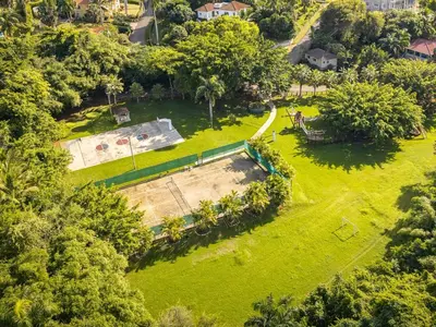 an aerial view of a park with a pool at Lovely Condo in Gated Community in Sosúa