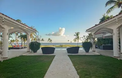 a porch of a house with a view of the ocean at Cacique 13, Ocean View and Golf Course in La Romana