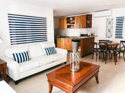 a living room with a white couch and a table at 2BR 2BA Beachfront 63 in Bayahibe