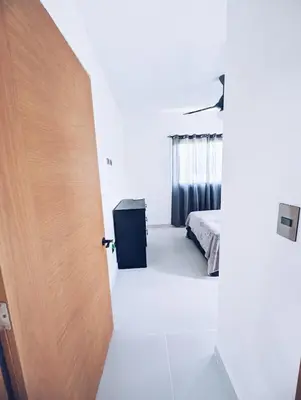 a room with a door leading to a bedroom at 2-bedroom apartment with 24h electricity and private parking in Sosúa
