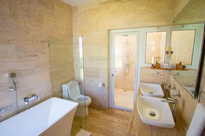 a bathroom with a sink and a toilet and a shower at Santa Fe Club in Sosúa