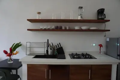 a kitchen with a sink and a stove top oven at Yara-ri Apartaments in La Majagua