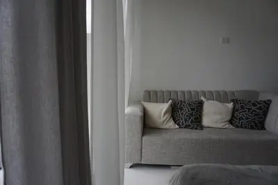 a living room with a couch with pillows on it at Yara-ri Apartaments in La Majagua