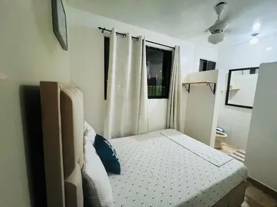 a small bedroom with a bed and a window at Casa en río san Juan 4 habitaciones in Río San Juan
