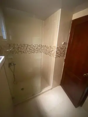 a shower with a glass door in a bathroom at Como apartamento in La Javilla