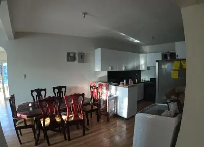 a kitchen and dining room with a table and chairs at My propio esfuerzo in Vicente Noble