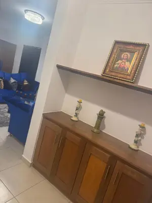 a living room with a picture on the wall at Renta Vacacional en el Caribe in Ciruelitos Arriba