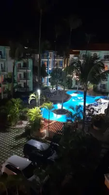 a view of a swimming pool at night at Penthouse in El Cortecito in Punta Cana