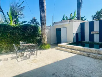 a patio with a table and chairs and a building at Villas Miranda in La Tentación