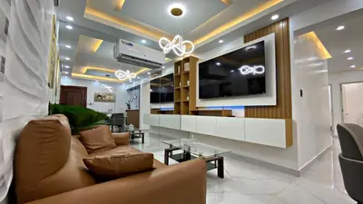 a living room with a couch and a flat screen tv at Apartamento in Mendoza
