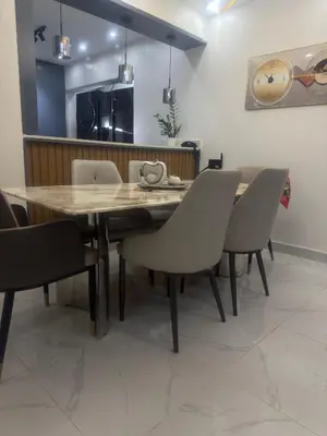 a dining room with a wooden table and chairs at Apartamento in Mendoza