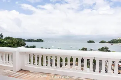 a view of the ocean from the balcony of a resort at Villas Hillside apt 1 in Santa Bárbara de Samaná