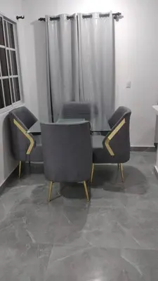 a glass table and chairs in a room at Villas Hillside apt 2 in Santa Bárbara de Samaná