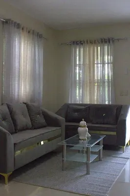 a living room with two couches and a coffee table at Casa de la presa in Monción