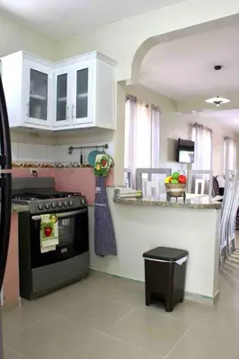 a kitchen with a stove and a counter top at Casa de la presa in Monción