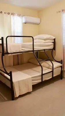 two bunk beds in a room with a window at Casa de la presa in Monción