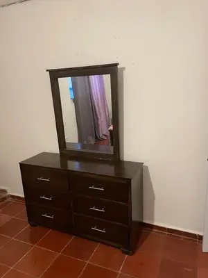 a dresser with a mirror on top of it at Kasita del sol boca chica in La Caleta