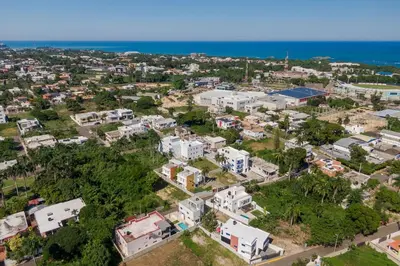 an aerial view of a city with houses and the ocean at Luxurious Home with Pool! in San Felipe de Puerto Plata