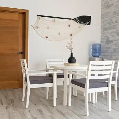 a dining room with a white table and chairs at Ocean Front Escape in Las Terrenas
