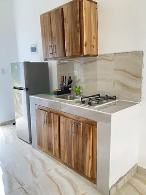 a kitchen with a sink and a refrigerator at Apartamento con Vista al Mar PalmeritaVillage in El Valle